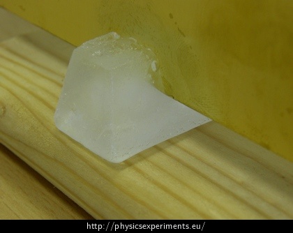 Fig. 2: Brass plate cutting through the ice cube